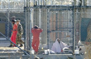 Inmates, Guards at Camp X-Ray. Guantanamo Bay, Cuba. Owned and Provided by Miami Herald. Photographer Unknown.